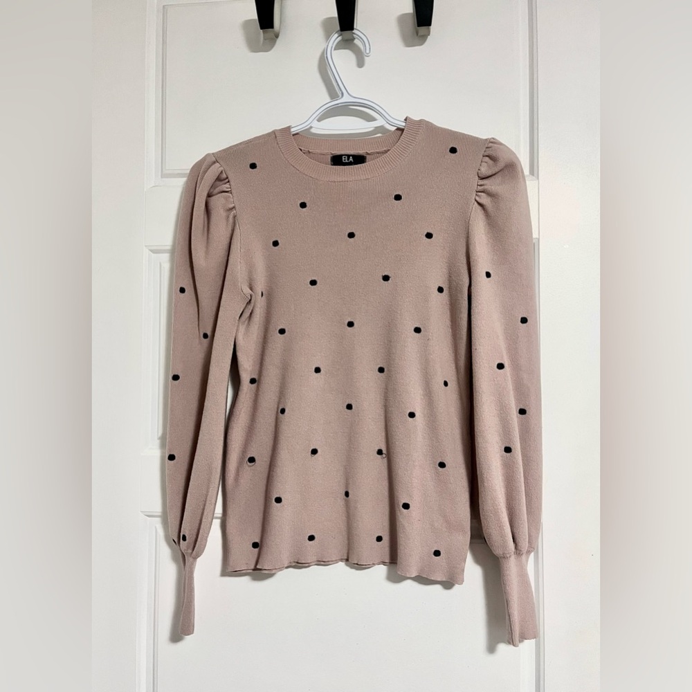 Adorable pink sweater. Features puff sleeves and subtle polka dots. Size small.